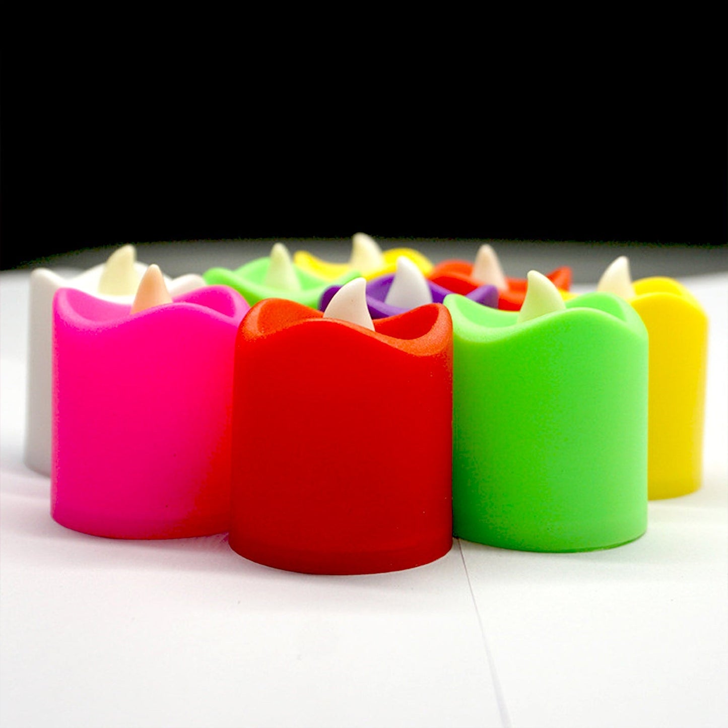 10 LED tealight candles creating a cozy ambiance on a wooden surface.