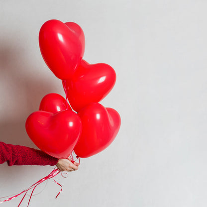 Assorted bright heart balloons adding festive charm to an event.