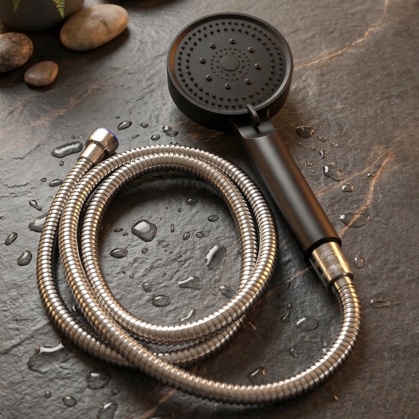 Flexible stainless steel shower hose attached to handheld shower head