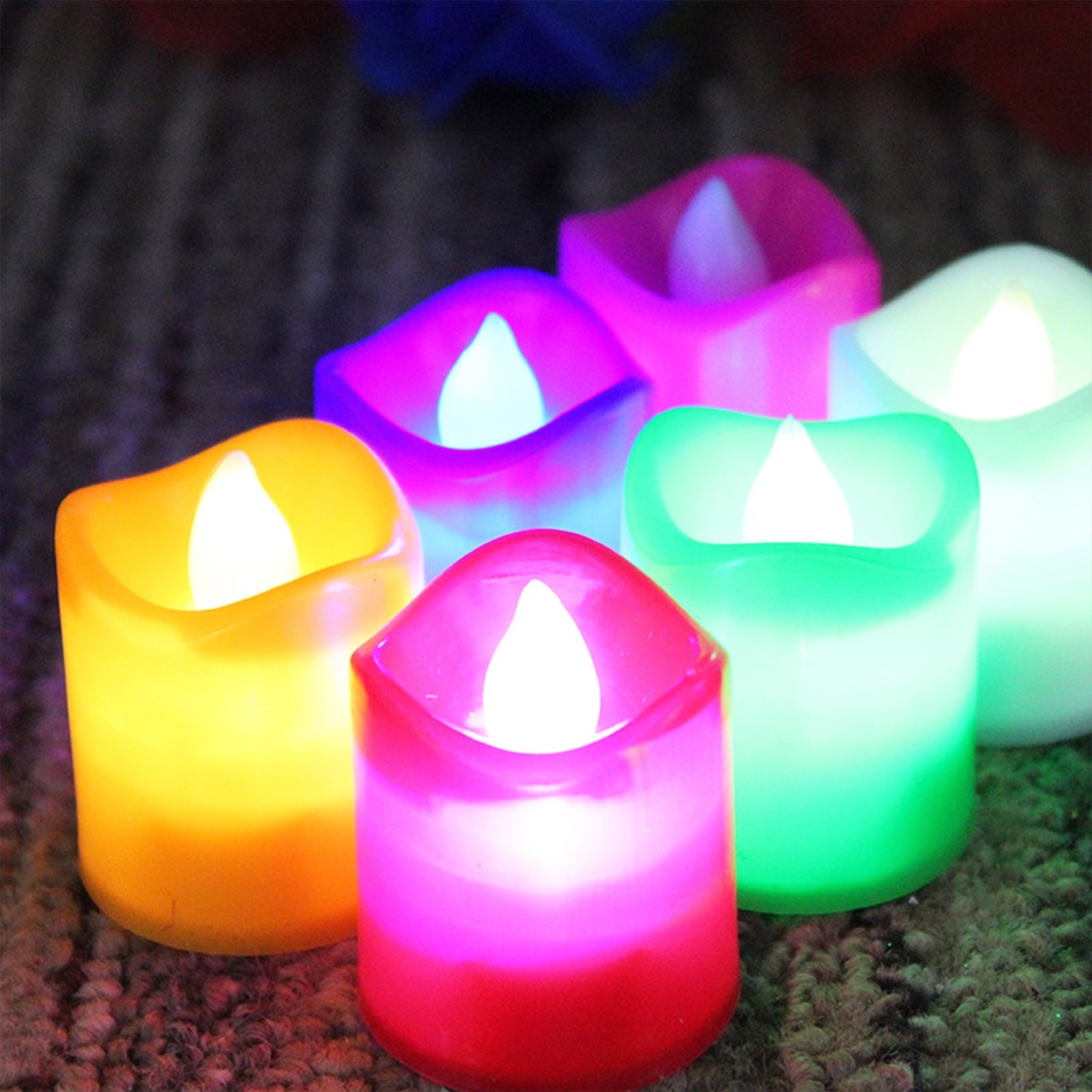 Vibrant multicolor LED tealight candles arranged for festive decoration.
