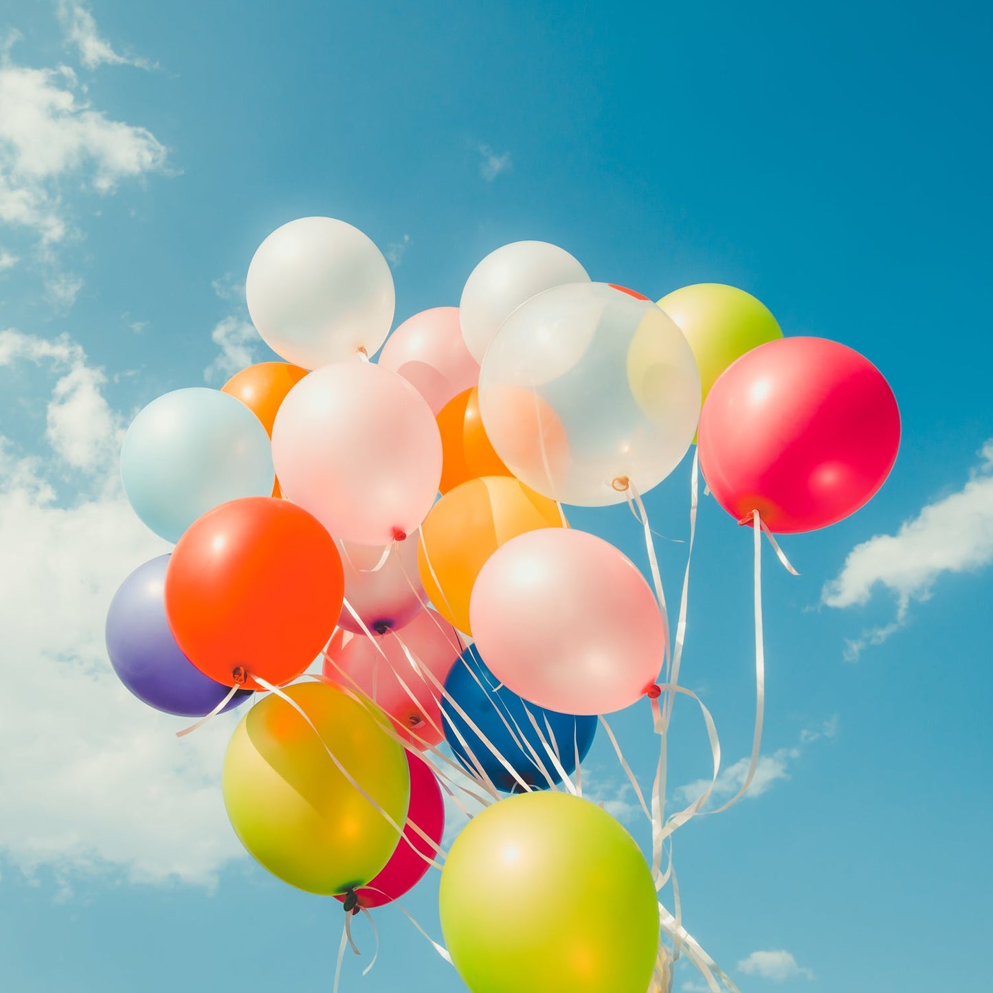 Assortment of vibrant multicolor latex balloons for party decoration.
