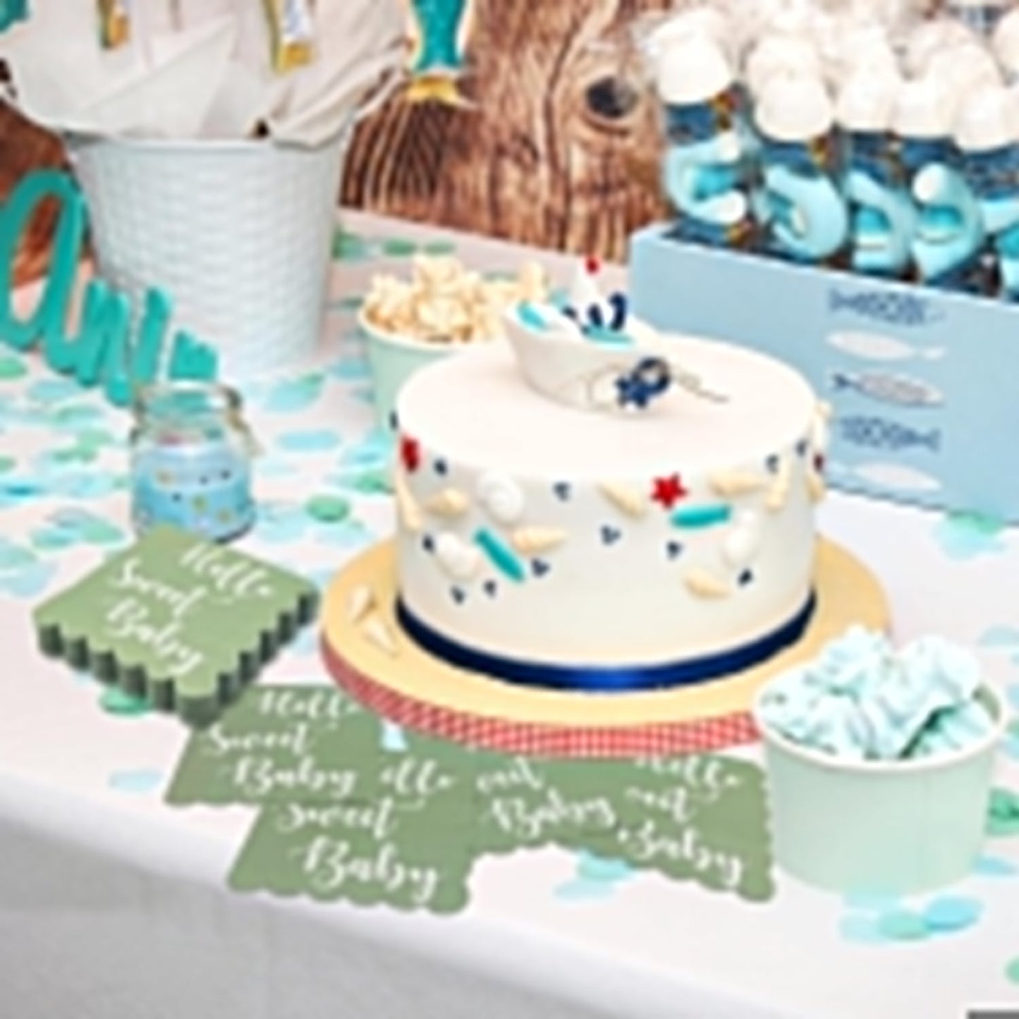 Mint green disposable paper napkins with decorative scalloped edges for baby shower
