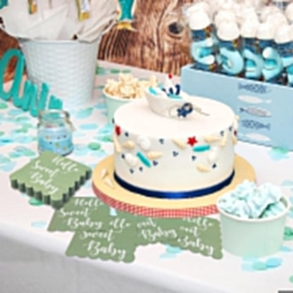 Mint green disposable paper napkins with decorative scalloped edges for baby shower