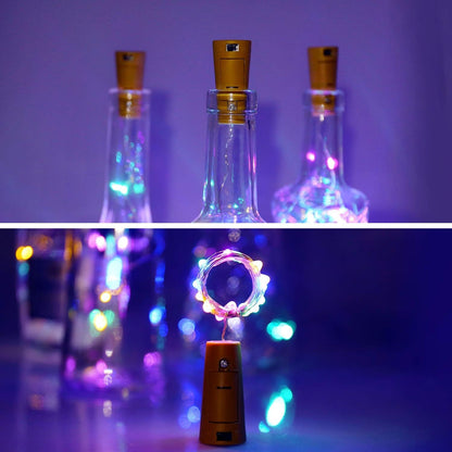 Several wine bottles adorned with multi-color LED bottle cork lights, showcasing their decorative effect.