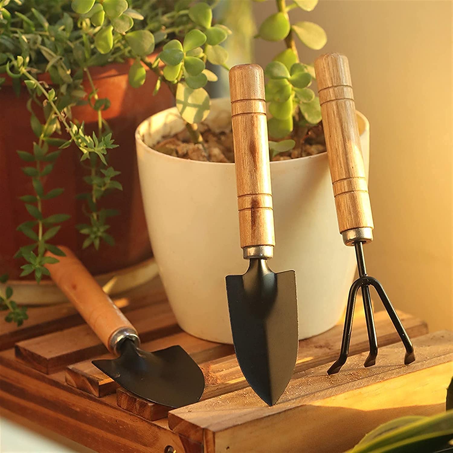 XcelCraft Garden Tool Set with hand cultivator, trowel, and garden fork.