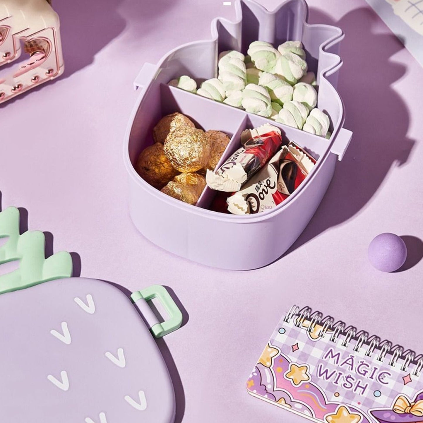 Side profile of the pineapple kids bento lunch box, highlighting its depth and compact design.