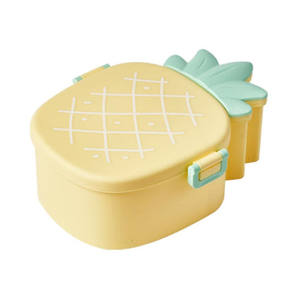 Angled view of an open pineapple kids snack container with its included fork and spoon.