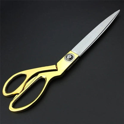 Ergonomic gold-plated handle of professional tailoring scissors, showcasing comfortable grip.