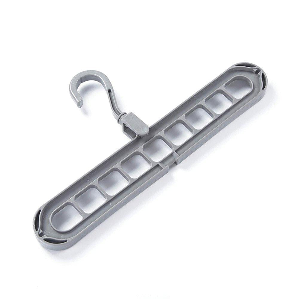 Several shirts and trousers neatly hung on the innovative 9-hole space saving hanger.