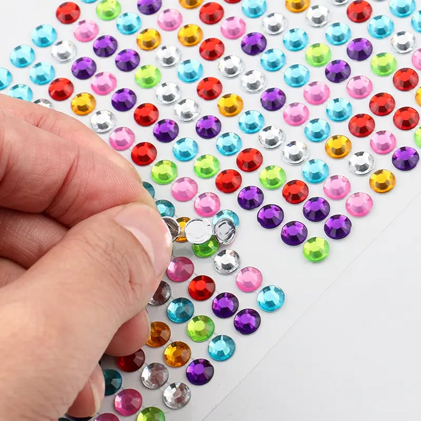 Variety of shaped crystal stickers ready for DIY creative projects and decoration.