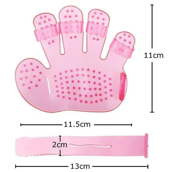 Pet grooming glove being used for bathing and grooming