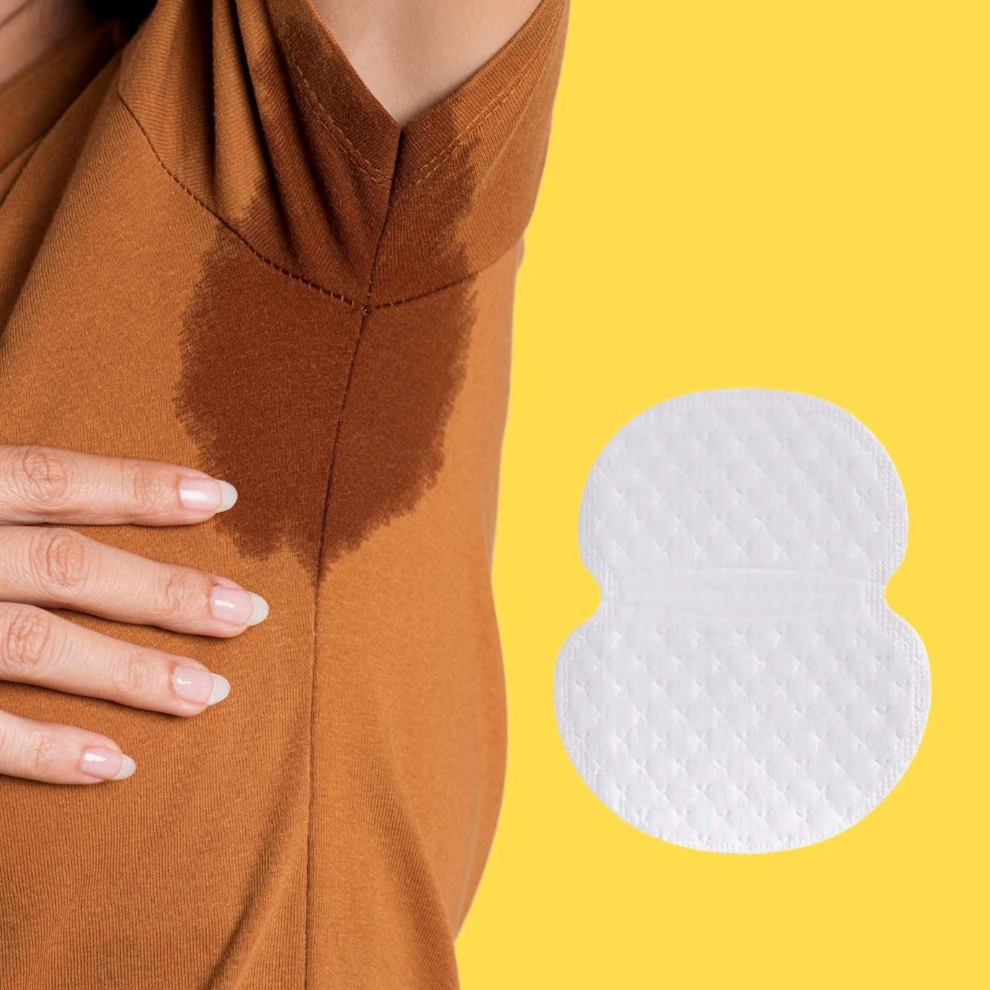 Several thin underarm sweat pads laid out on flat surface