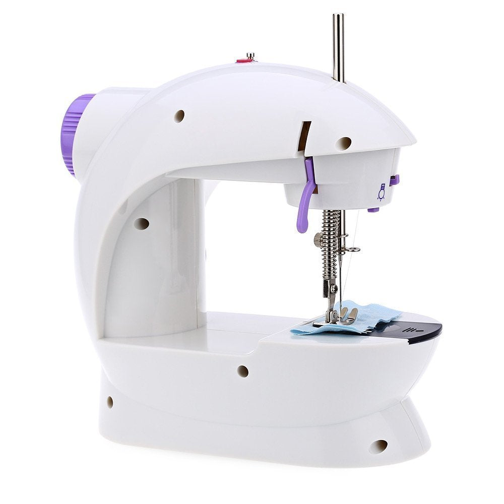 XcelCraft mini sewing machine performing a straight-line stitch on fabric.
