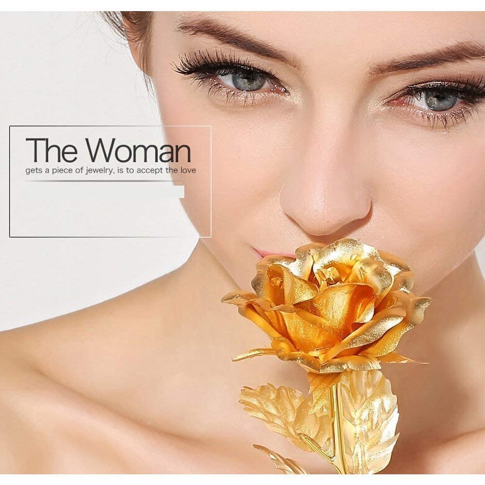 Gold plated rose placed on table enhancing luxury home decor