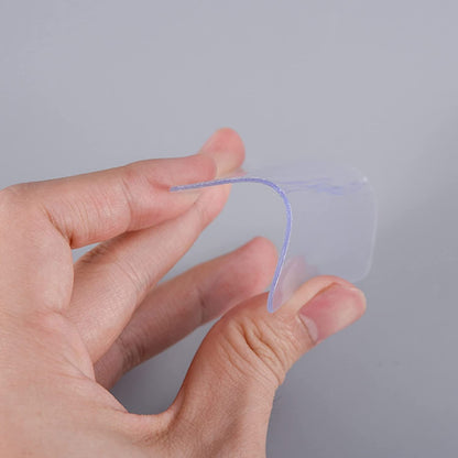 Durable clear tape applied to various household items for secure, mark-free display.