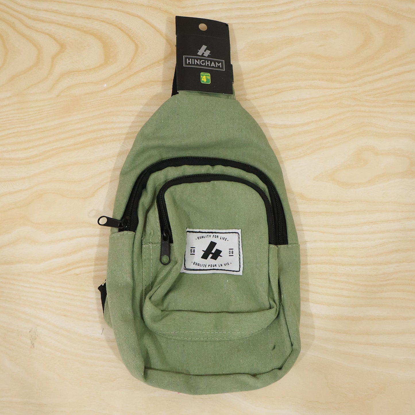 Compact sling bag with multiple compartments for gadgets and cards