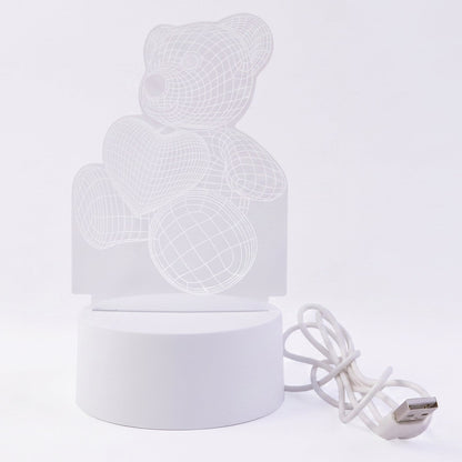 Teddy bear LED Night Lamp glowing softly in dark room