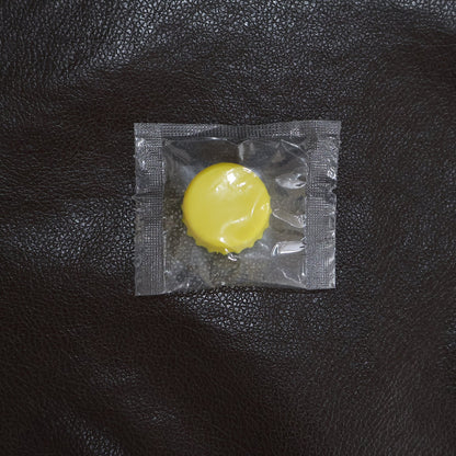 Reusable silicone bottle cap cover in use