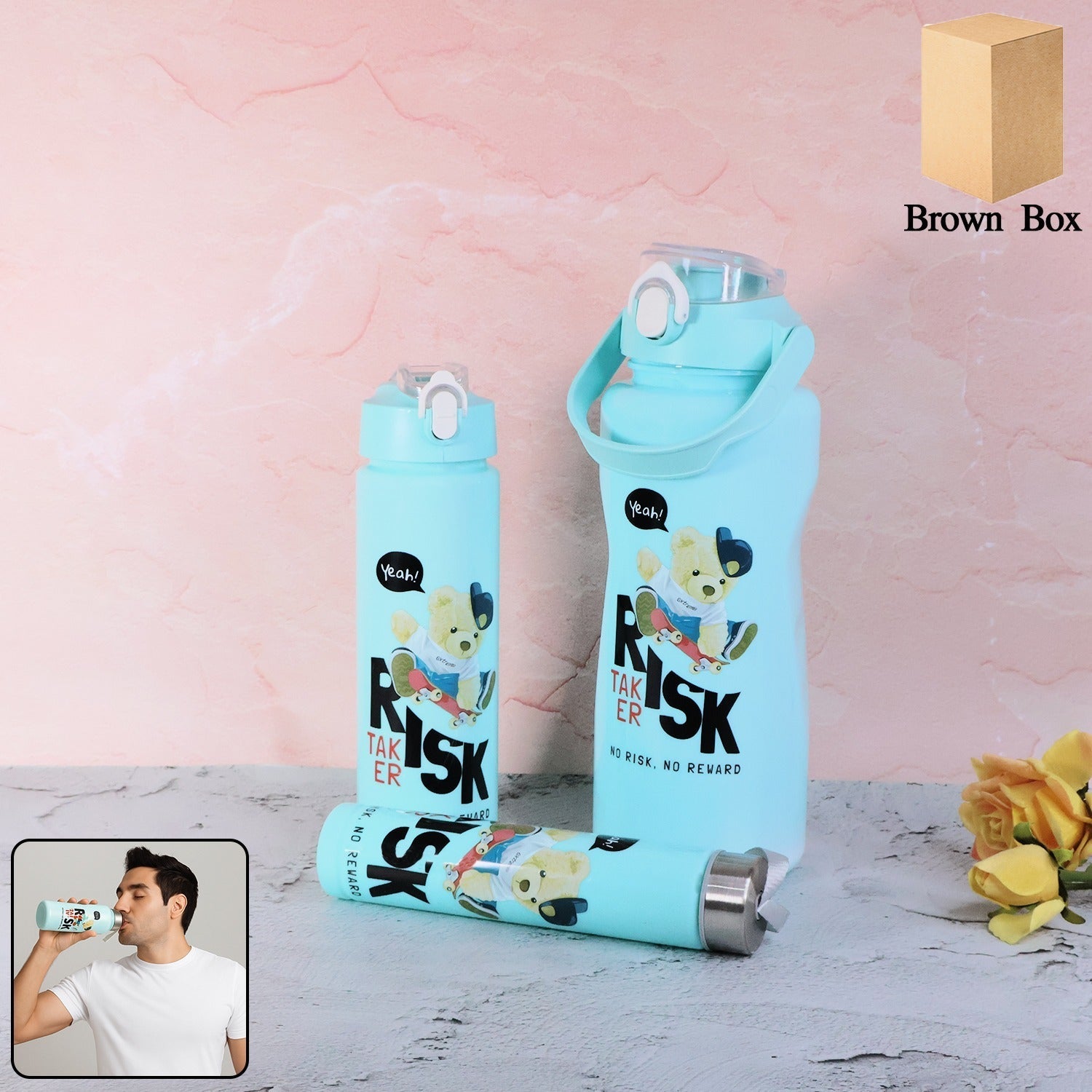 Close-up of Risk Taker water bottles showing printed cartoon bear and motivational text design