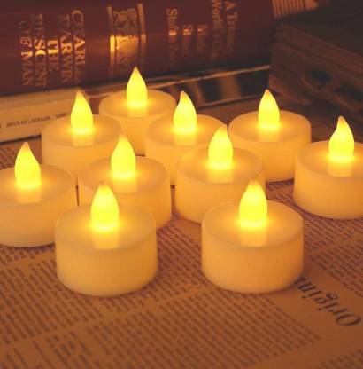 Flickering white LED tealight candle creating a warm ambiance.